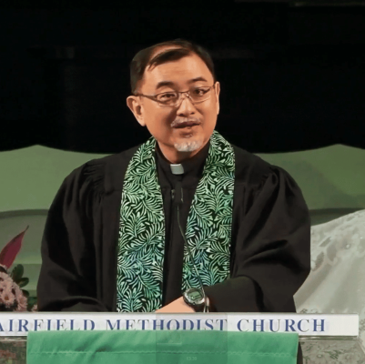 Church pastor speaking at Fairfield Methodist Church Singapore, a vibrant Methodist place of worship.
