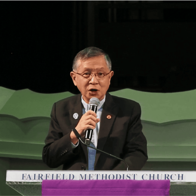 Community leader speaking at Fairfield Methodist Church during a church event.