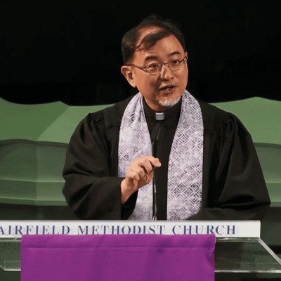 Spiritual leader at Fairfield Methodist Church, Singapore, delivering a sermon on faith and community.