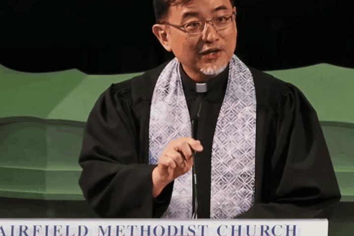 Spiritual leader at Fairfield Methodist Church, Singapore, delivering a sermon on faith and community.