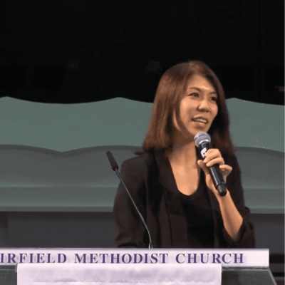 Fredfield Methodist Church speaker giving a presentation at a church event, emphasizing faith and community.