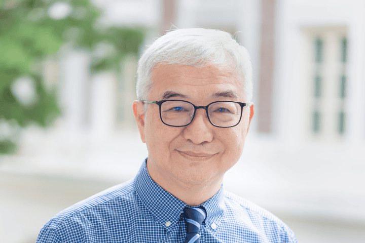 Friendly senior man smiling in outdoor setting, representing community and faith at Fairfield Methodist Church.
